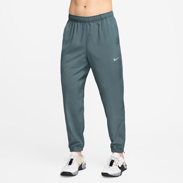 NIKE Tapered Workout Pants in Green: front