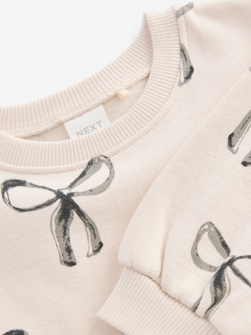 Next Klänning i beige