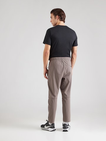 pelēks Nike Sportswear Pakapēniski sašaurināts piegriezums Bikses