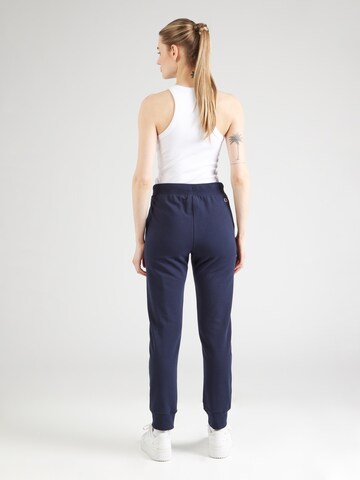 Tapered Pantaloni di Champion Authentic Athletic Apparel in blu