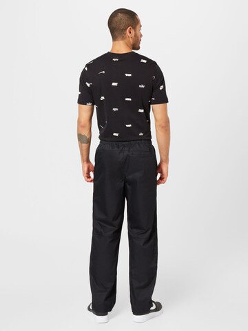 Nike Sportswear Loose fit Trousers 'Club' in Black