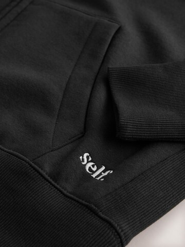 self. - Sudadera con cremallera en negro