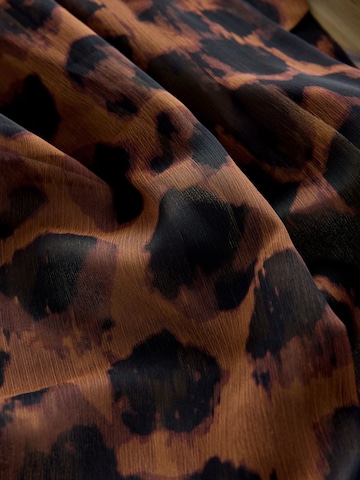 Next Strandrock in Braun