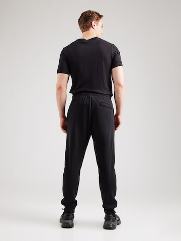 Tapered Pantaloni di Nike Sportswear in nero