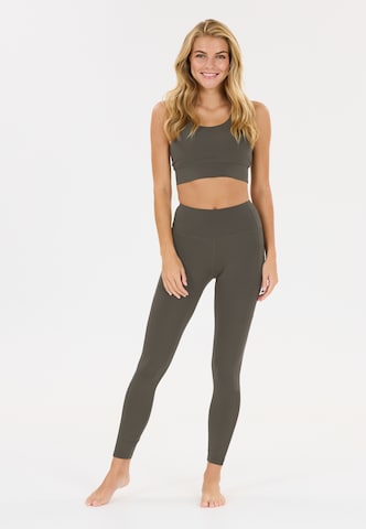 Athlecia Skinny Sportbroek 'Elli' in Bruin