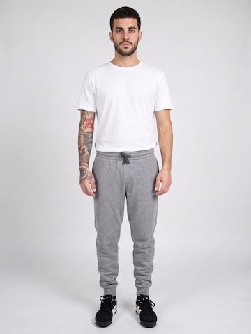 Baggy Pantalon 'UA Rival Fleece Joggers Grey' UNDER ARMOUR en gris