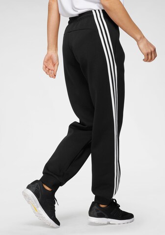 ADIDAS SPORTSWEAR Tapered Sportbyxa i svart