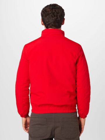 Tommy Jeans Prechodná bunda 'Essential' - Červená