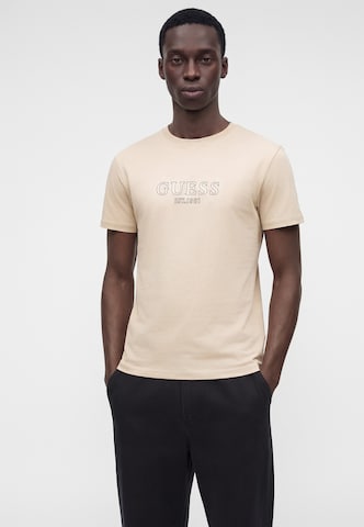 Maglietta di GUESS in beige