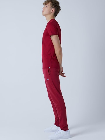 SPORTKIND - Slimfit Pantalón deportivo 'Slim Training Pants' en rojo