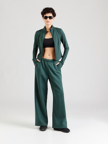 Fabletics - Perna larga Calças de desporto em verde