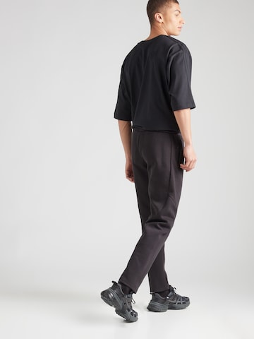 PUMA Regular Sportbroek 'EVOSTRIPE' in Zwart