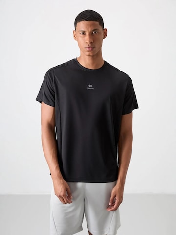 T-Shirt fonctionnel Tommy Life en noir : devant