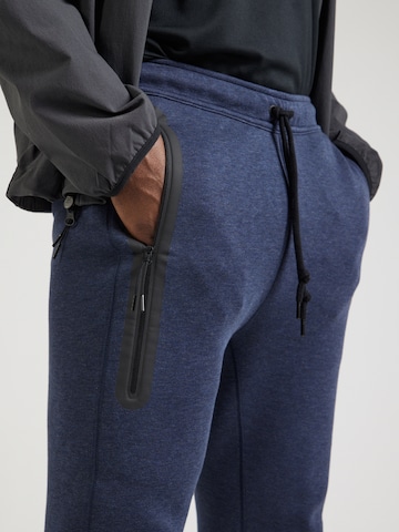 Nike Sportswear Zúžený Kalhoty 'TECH FLEECE' – modrá