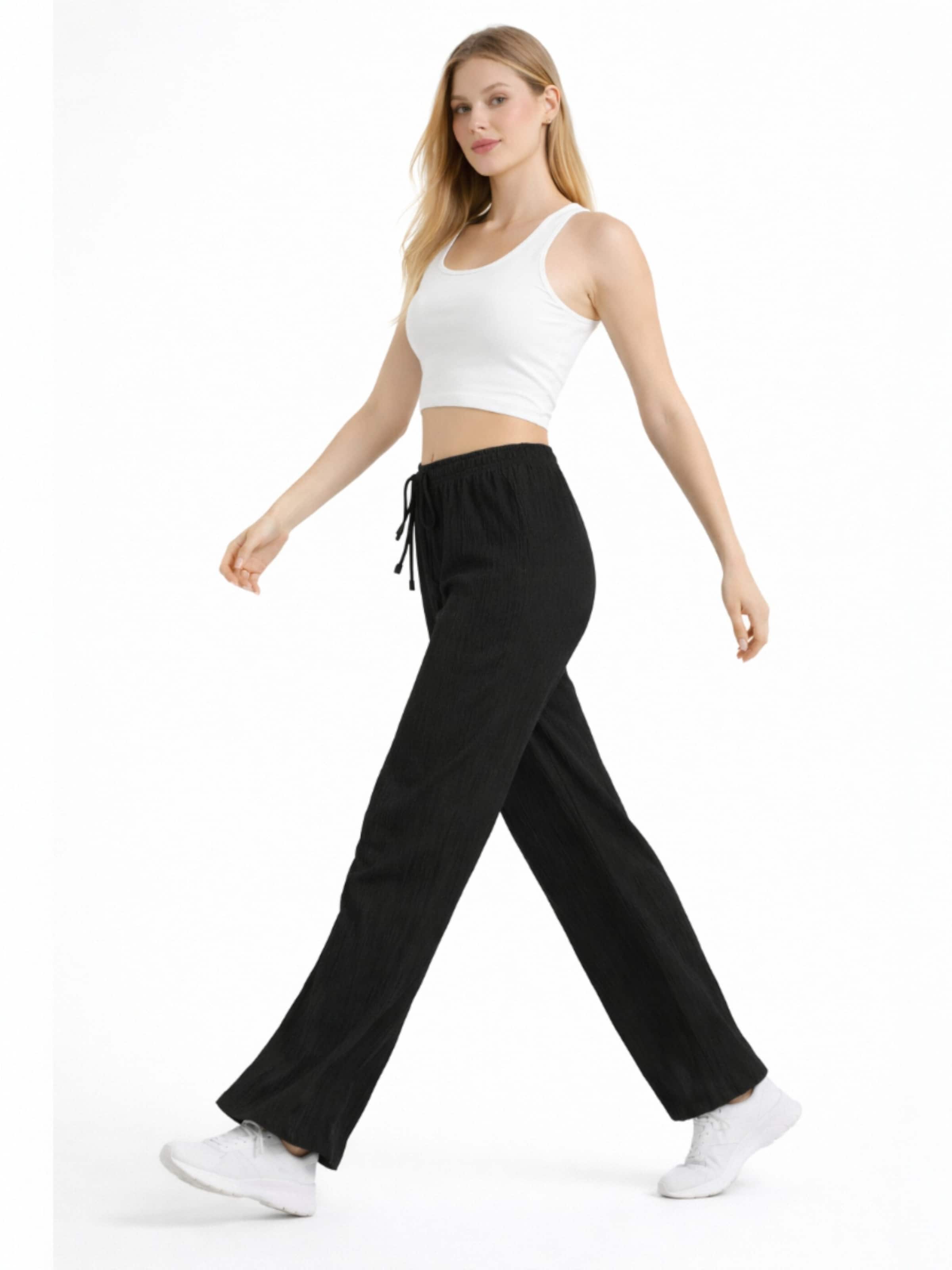 Wide leg Pantaloni 'FLORYN – Palazzohose Crinkle' di fashionshowcase in nero