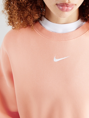 Nike Sportswear - Sudadera 'Phoenix Fleece' en naranja