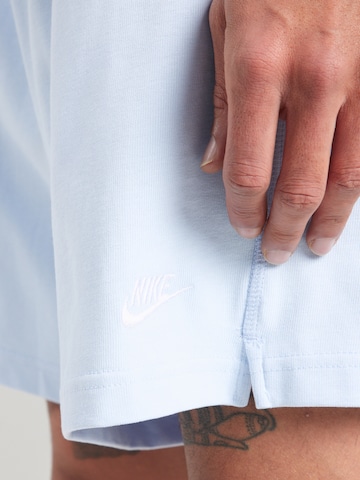 Loosefit Pantalon 'Club' Nike Sportswear en bleu