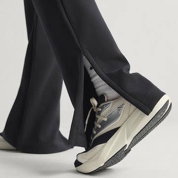 évasé Pantalon de sport 'All Szn' ADIDAS SPORTSWEAR en noir