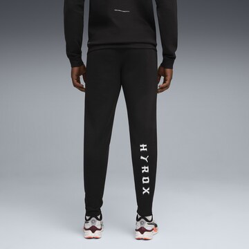 PUMA Regular Sports trousers in Black