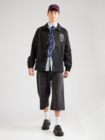Veste mi-saison 'COACHES NEYYAN ' NEW ERA en noir