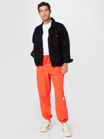 ADIDAS SPORTSWEAR Tapered Sports trousers in Red