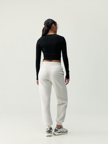 Born Regular Sports trousers ' Bloom ' in Beige