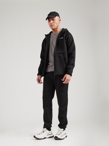 ELLESSE - Tapered Pantalón 'Latoso' en negro