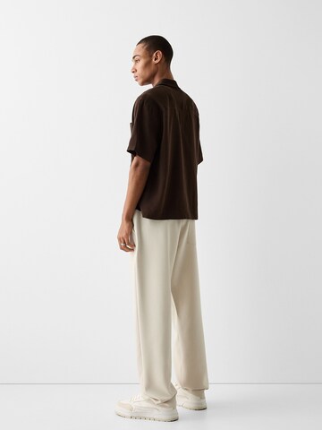 Bershka Loose fit Pleat-Front Pants in Beige