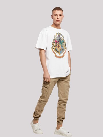 F4NT4STIC T-Shirt 'Harry Potter Hogwarts Crest Gold' in Weiß
