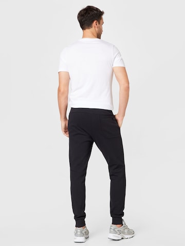 Champion Authentic Athletic Apparel Tapered Hose in Schwarz