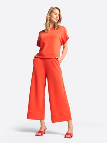 Wide leg Pantaloni di Rich & Royal in arancione