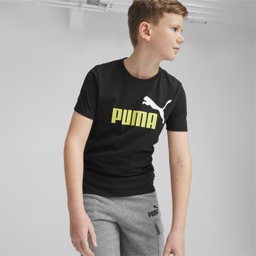 PUMA T-shirt 'Essential' i svart: framsida