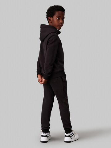 Calvin Klein Jeans - Tapered Calças em preto