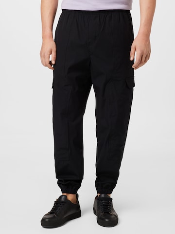 Calvin Klein Jeans Tapered Cargo Pants in Black: front