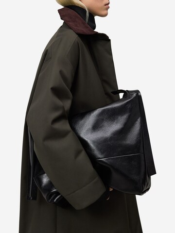 Palton de primăvară-toamnă de la Adolfo Dominguez pe verde