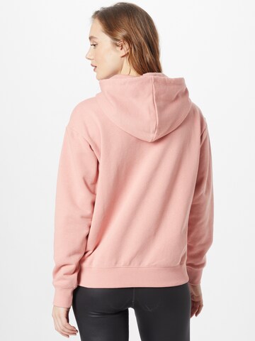 Felpa di Champion Authentic Athletic Apparel in rosa