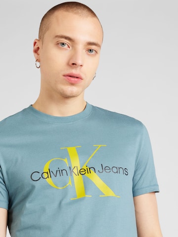 Calvin Klein Jeans قميص بلون أزرق
