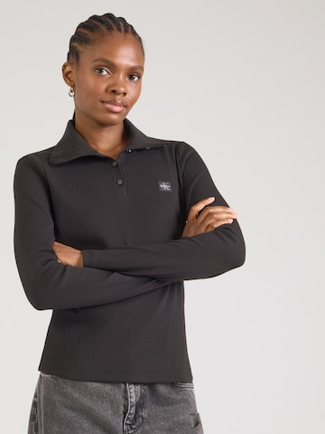 T-shirt Calvin Klein Jeans en noir : devant