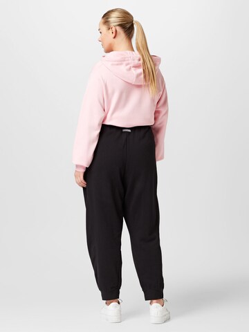 Nike Sportswear Tapered Urheiluhousut värissä musta