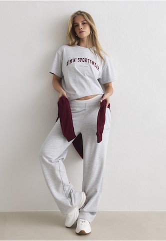 Aim'n Funkční tričko 'Varsity' – šedá