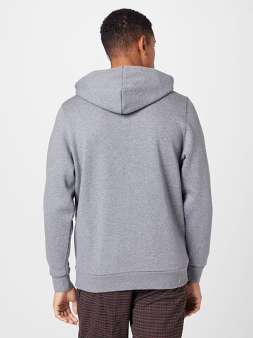 UNDER ARMOUR Urheilullinen collegepaita 'Essential' värissä harmaa