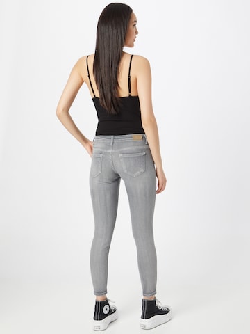 Skinny Jean 'CORAL' ONLY en gris