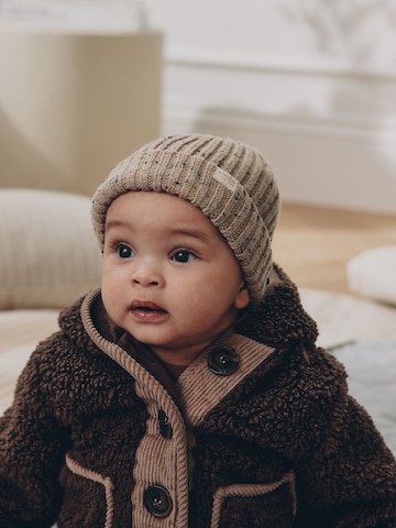 Next Muts in Beige: voorkant