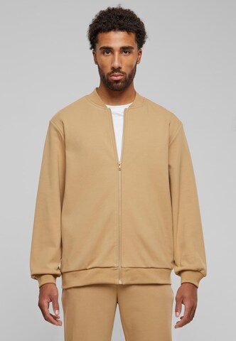 Veste de survêtement Urban Classics en beige : devant