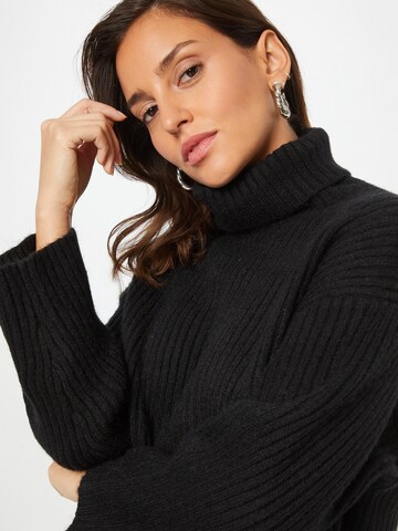 ABOUT YOU Sweater 'Caya' in Black