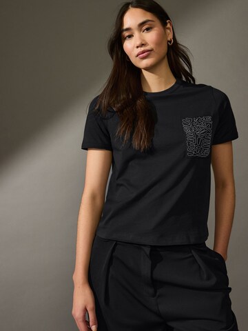 Next T-Shirt in Schwarz: Vorderseite