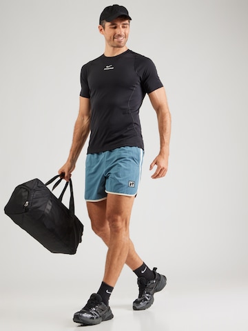T-Shirt fonctionnel 'NPT' NIKE en noir