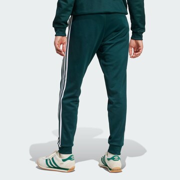 ADIDAS ORIGINALS Tapered Trousers in Green