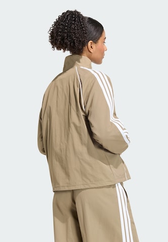 ADIDAS SPORTSWEAR - Casaco de treino 'Iconic' em verde