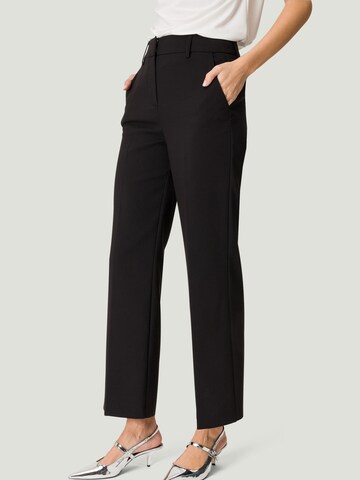 zero Slim fit Pleated Pants in Black: front